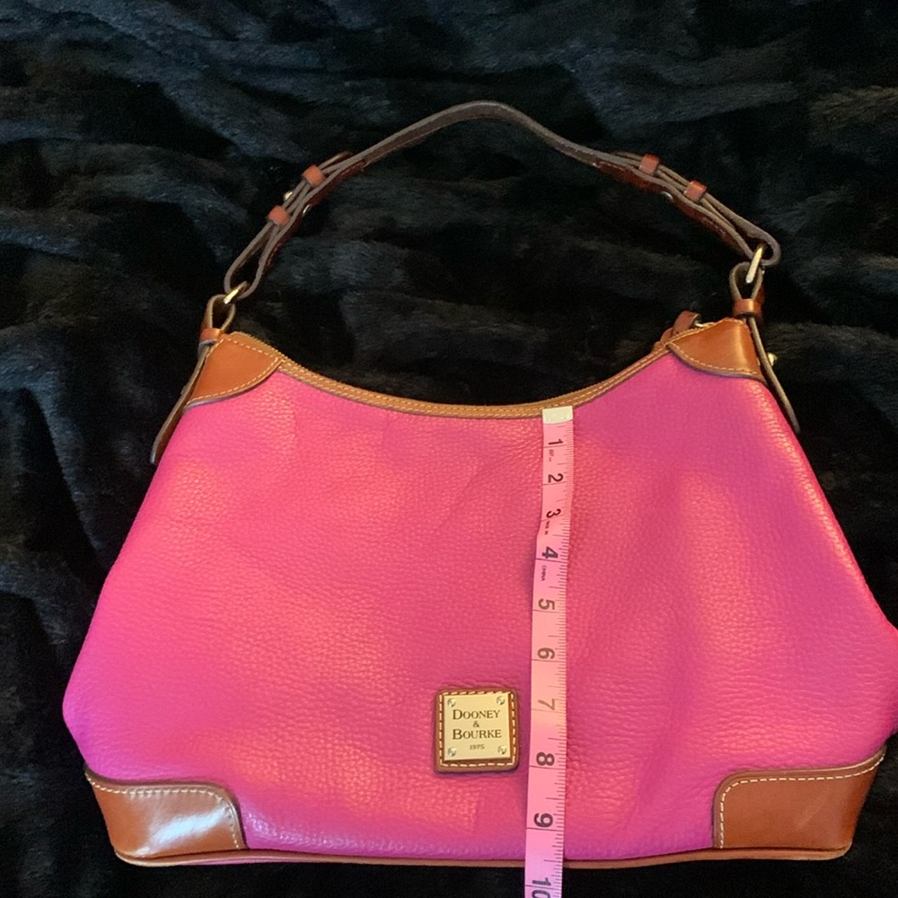 Dooney & Bourke hot pink Pebble Grain Leather  trim with protective feet